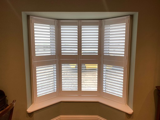 Close-up of tier-on-tier hardwood shutter 