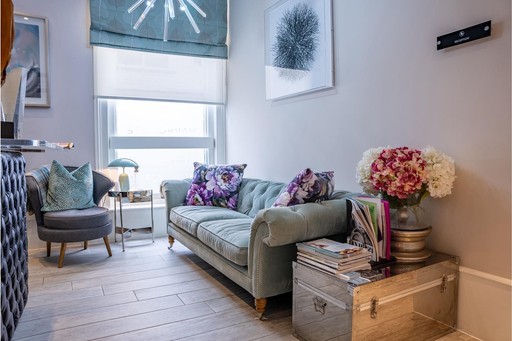 Stylish patient lounge at The Harrogate Clinic with comfortable seating, modern décor, and a warm homely atmosphere, designed to help patients relax before their dental or cosmetic treatment in Harrogate, North Yorkshire.