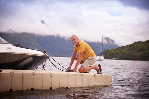 Man gets ready to take his boat out for a ride at Loch Lomond