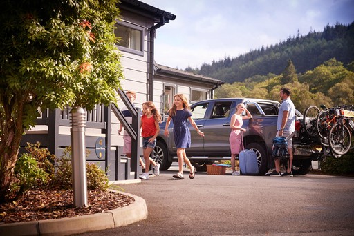 Family arrive at their holiday home, ready for their break at Loch Lomond Holiday Park