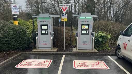 InstaVolt EV charging bays on a rainy day at OK Diner Leominster, with two chargers and branded parking